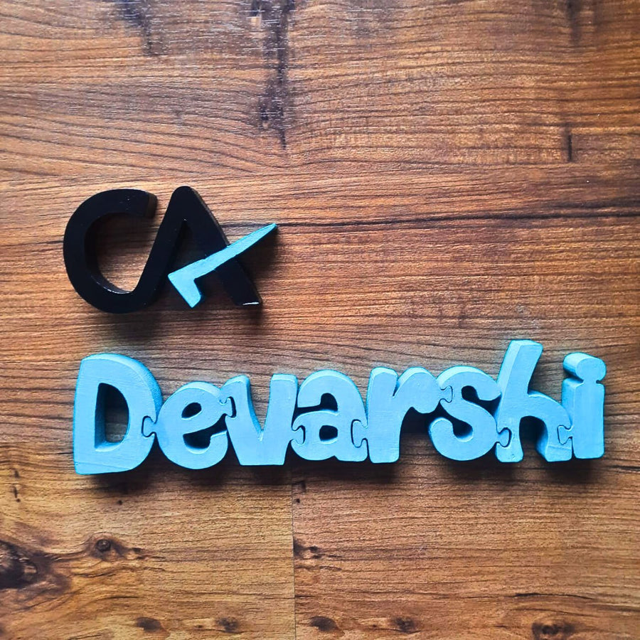 Hand Painted Wooden Tabletop Jigsaw Name Blocks For Ca - Top-down View on Wooden Surface