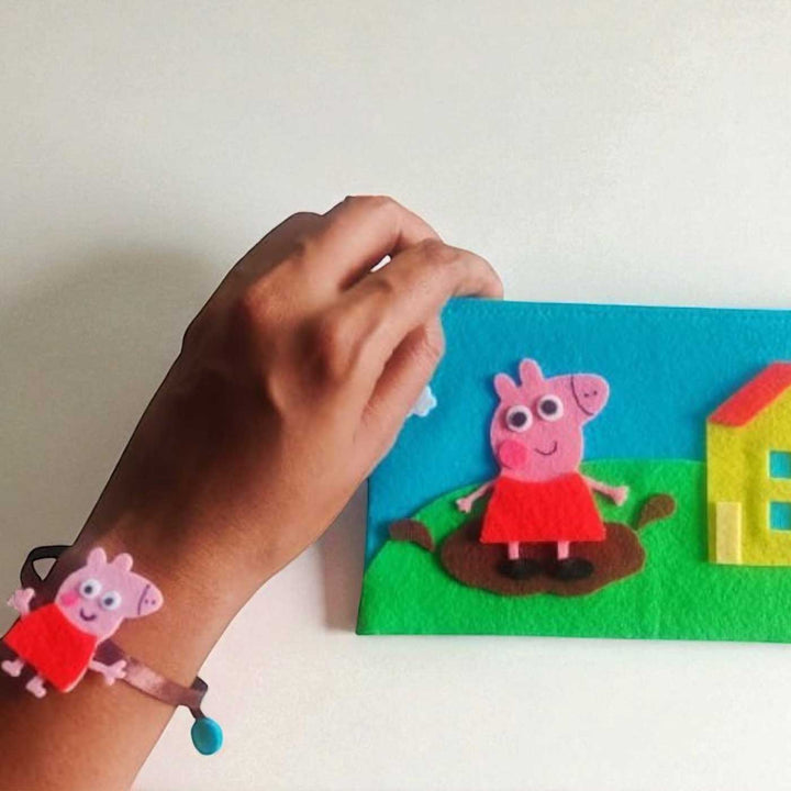 Handmade Peppa Pig Theme Felt Rakhi Hamper Includes 1 Rakhi And 1 Pouch - On Wrist Wristband Display
