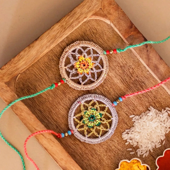 Handmade Crochet Dreamcatcher Rakhi With Roli Chawal Set Of 2 - Close-up of two woven bracelets