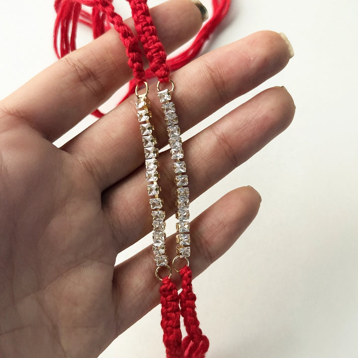 Handmade White Stone Bracelet Rakhi With Roli Chawal - Held in Hand Display