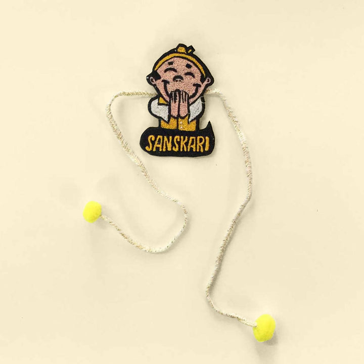 Handmade Sanskari Pom Pom Felt Rakhi For Brother - Lay-flat View Showing Entire Design