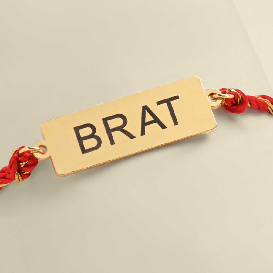 Handmade Brat Design Metal Rakhi - Close-up of Bracelet Tag