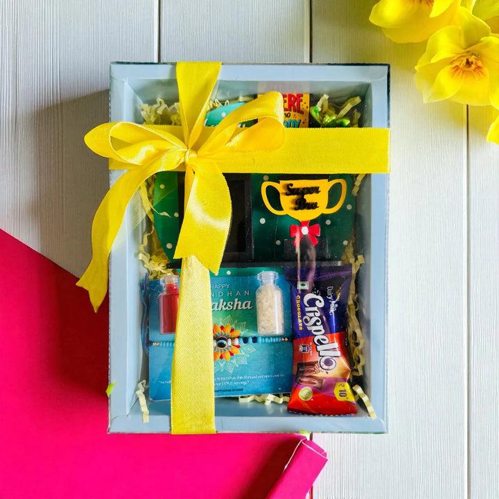 Photo Personalized Super Bro Mdf Wood Rakhi Hamper With Chocolates And Roli Chawal Includes 1 Fridge Magnet 1 Rakhi - Gift Box with Yellow Ribbon