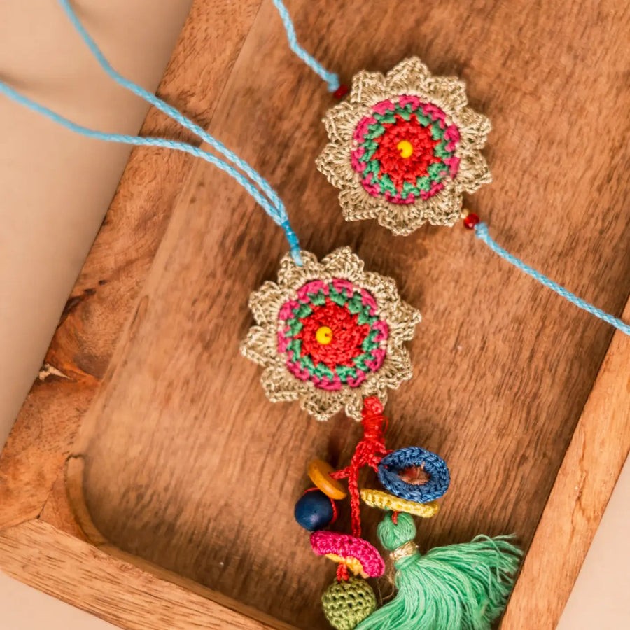 Handmade Crochet Golden Sunshine Bhaiya Bhabhi Rakhi With Roli Chawal Set Of 2 - Close-up of Crochet Keychain