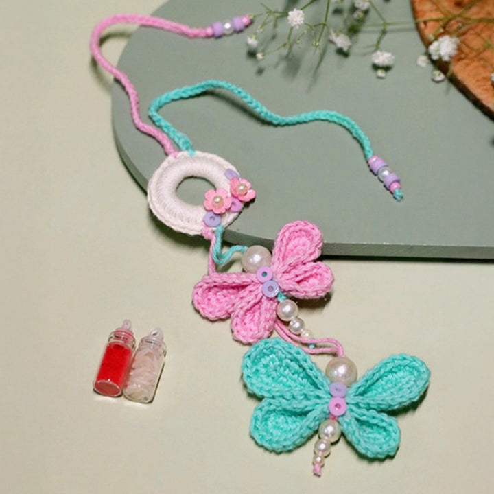 Handmade Crochet Budding Butterflies Kids Lumba Rakhi For Girls With Roli Chawal - Close-up of knitted butterflies