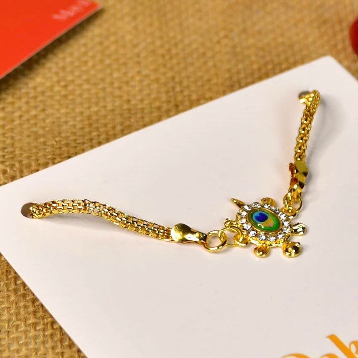 Green Turtle Pearl And Stone Bracelet Rakhi Hamper With Chocolates And Roli Chawal For Brother Customizable Options Includes Up To 7 Goodies - Bracelet Close-up Angle
