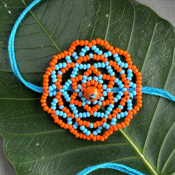 Customized Handmade Beaded Mandala Design Lumba Rakhi For Bhabhi With Roli Chawal - Close-up on Beaded Pendant