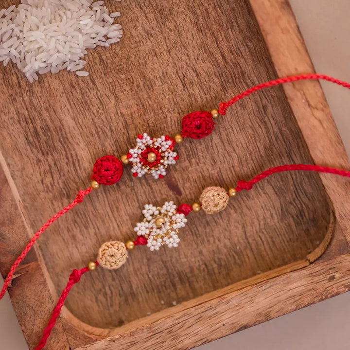 Handmade Crochet Red And White Flower Rakhi With Roli Chawal Set Of 2 - Top view of bracelet pair details