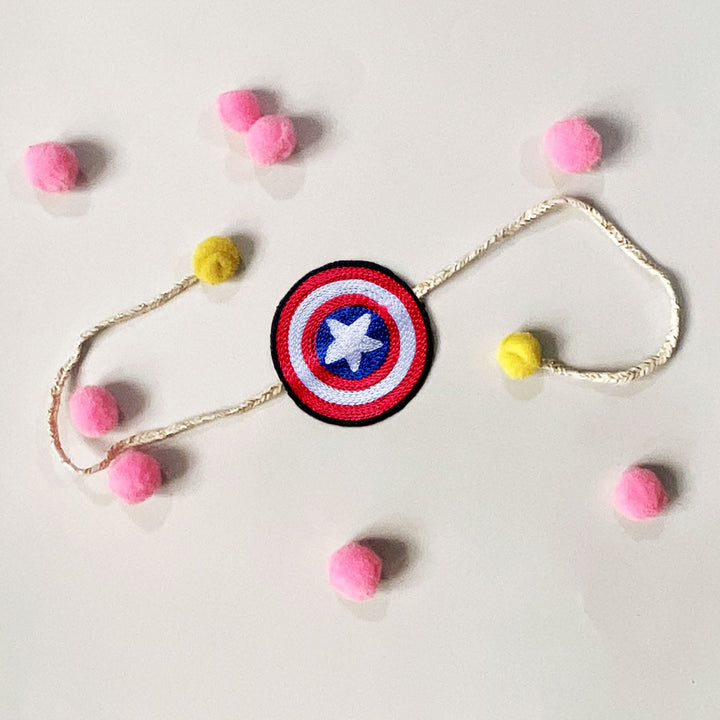 Handmade Reusable Captain America Theme Pom Pom Felt Kids Rakhi - Laid Flat with Decorative Pom Poms