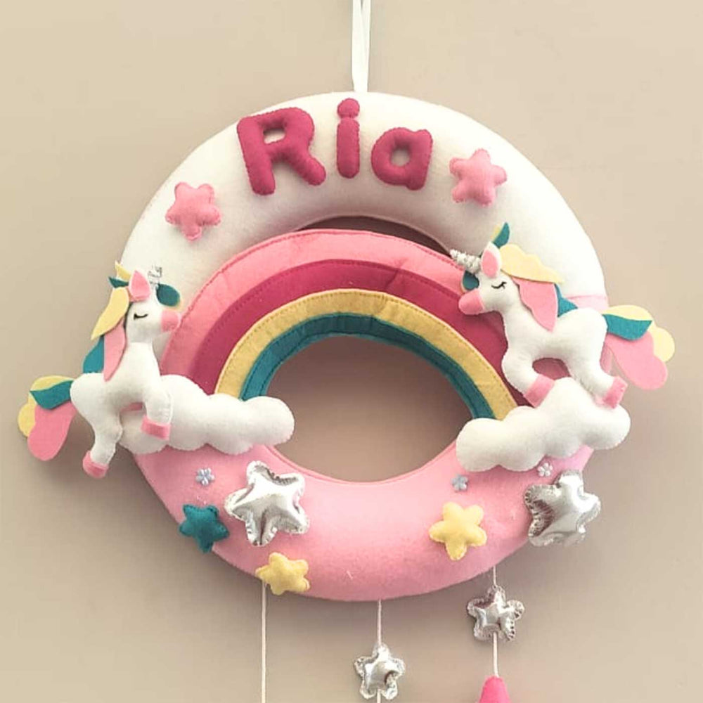 Personalized White And Pink Unicorn Theme Round Felt Kids Nameplate - Front View Hanging on Wall
