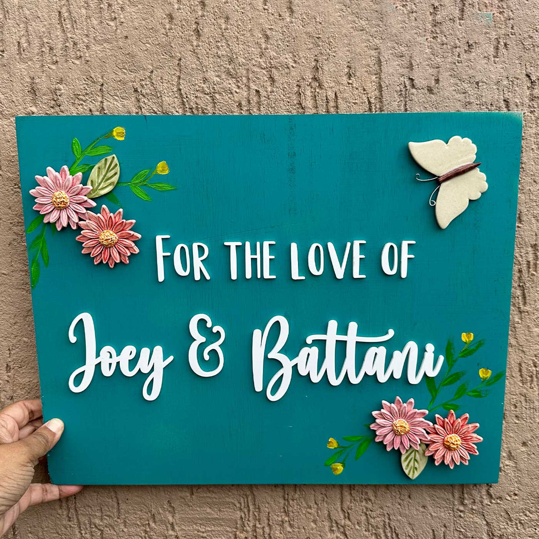 Personalized Handmade Floral Wooden Name Plate For Couples - Handheld Front View with Decorations