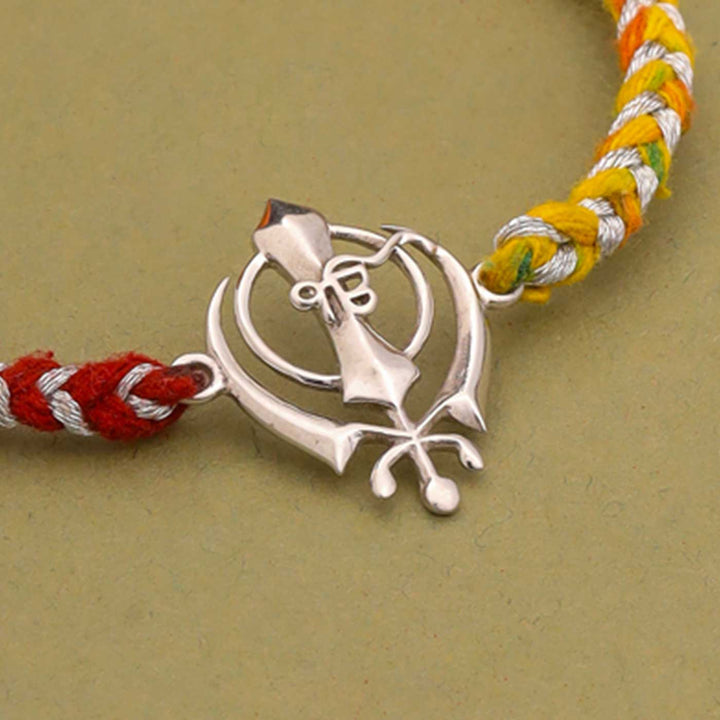 Handmade Sikh Design Religious Silver Rakhi For Brother - Close-up of Pendant Detail