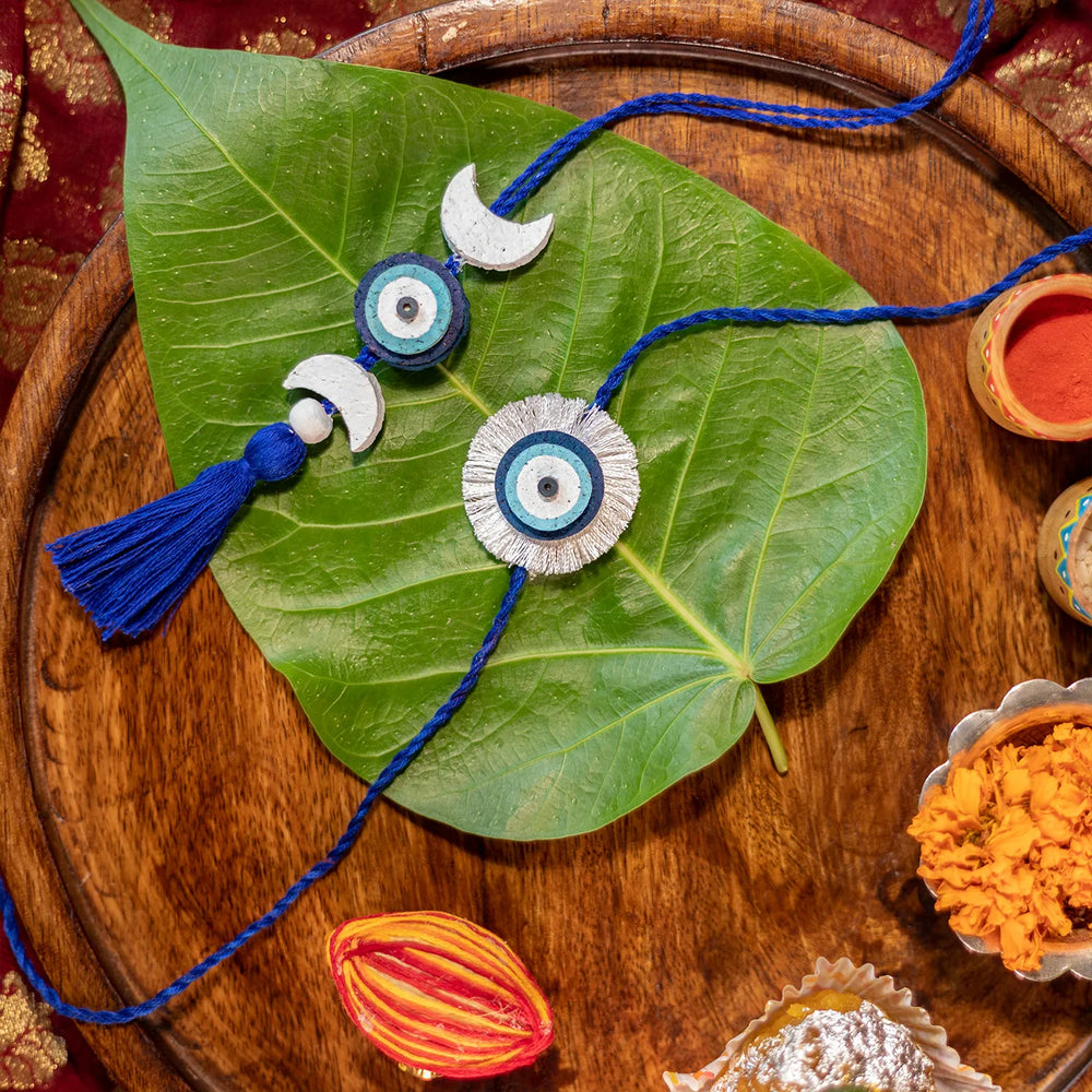 Nazarbattu Plantable Eco Friendly Handmade Cork Rakhi With Roli Chawal - Rakhis displayed on leaf and tray