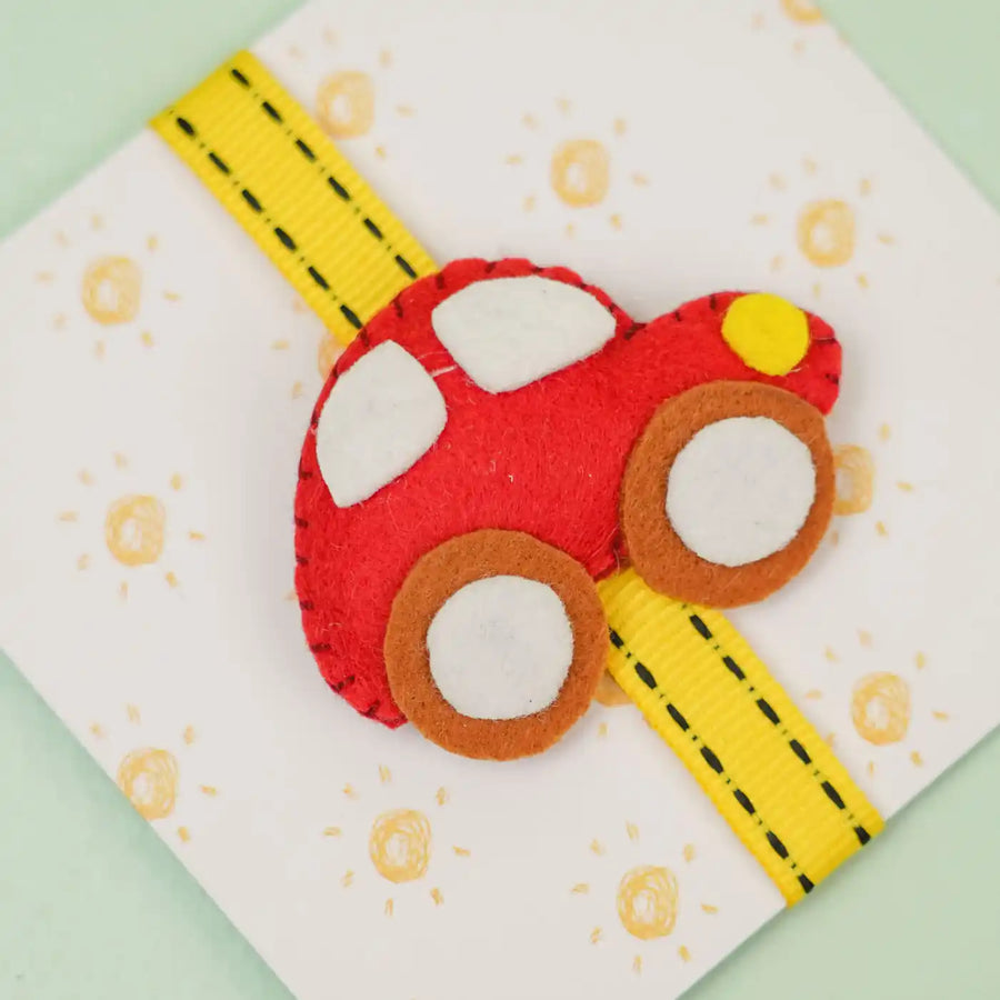 Handmade Car Theme Felt Kids Rakhi With Roli Chawal - Close-up on Red Car Decoration
