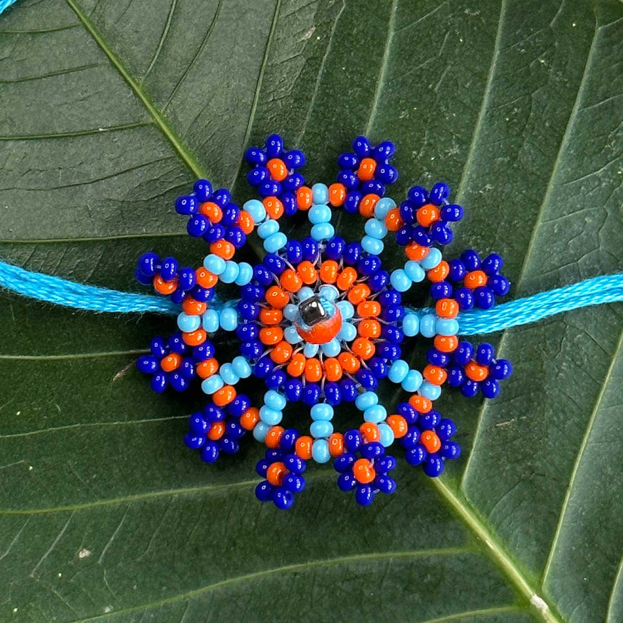 Customized Handmade Beaded Phool Design Lumba Rakhi For Bhabhi With Roli Chawal - Close-up on Beaded Pendant