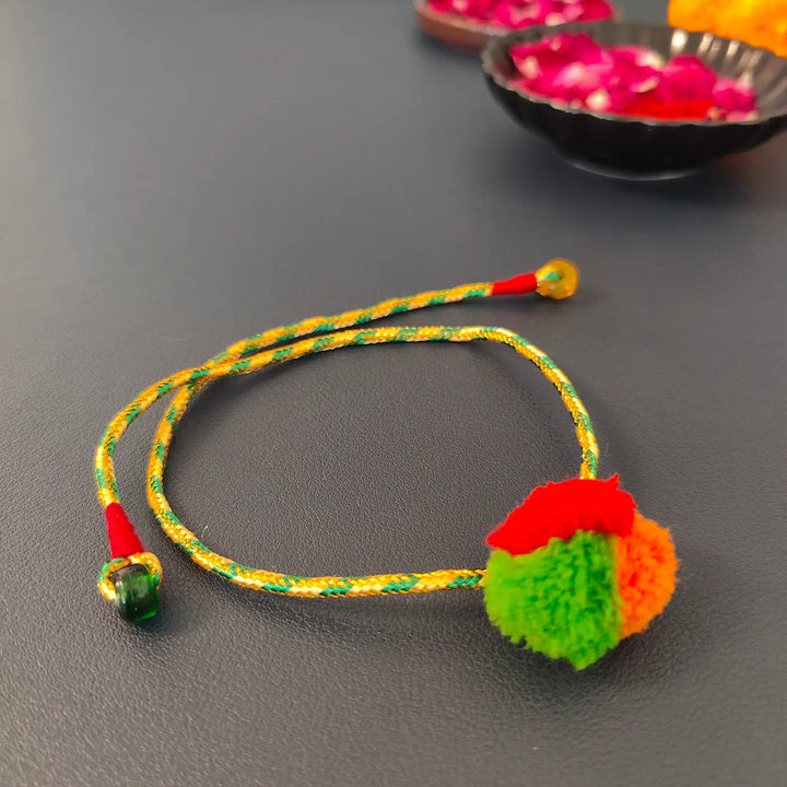 Handmade Multicolour Pom Pom Rakhi With Roli Chawal