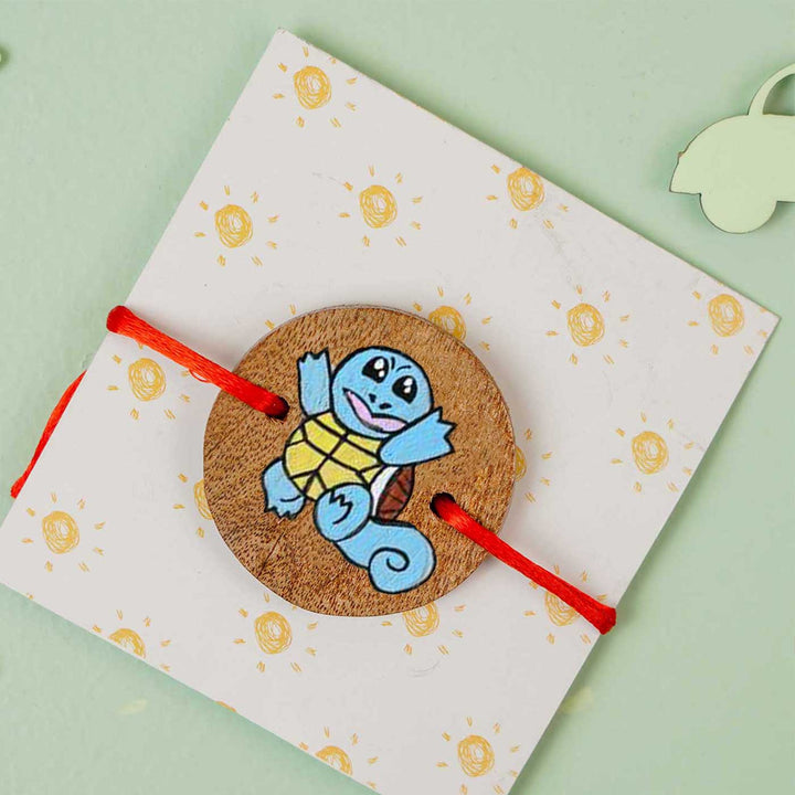 Personalized Hand Painted Squirtle Wooden Rakhi With Roli Chawal - Mounted on Decorative Card