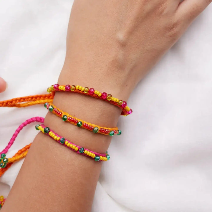 Handmade Beaded Minimalist Manku Rakhi With Roli Chawal Set Of 3 - Close-up of Bracelets on Wrist