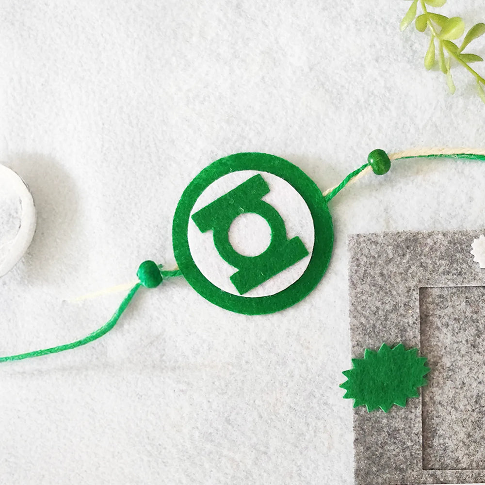 Photo Personalized Green Lantern Felt Rakhi Hamper With Roli Chawal Includes 1 Magnetic Photo Frame 1 Rakhi - Close-up of Bracelet Detail