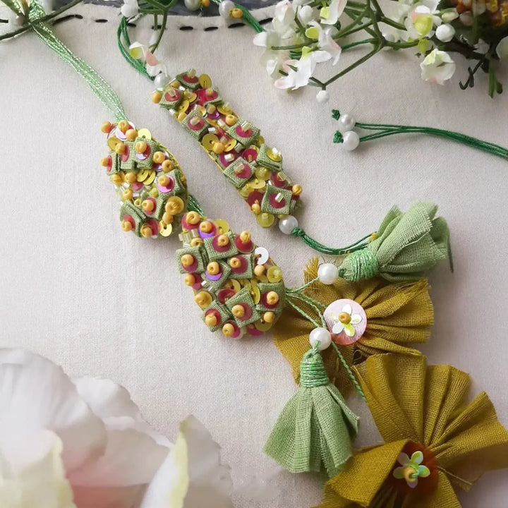 Hand Embroidered Beaded Pista Bhaiya Bhabhi Rakhi With Roli Chawal Set Of 2 - Close-up of Ornament Details (3)