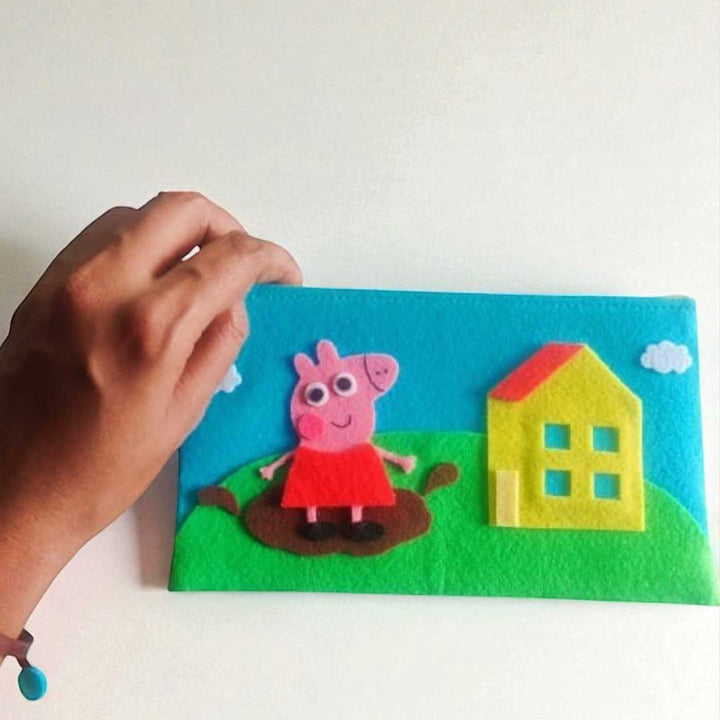 Handmade Peppa Pig Theme Felt Rakhi Hamper Includes 1 Rakhi And 1 Pouch - Hand Holding Pouch Front View
