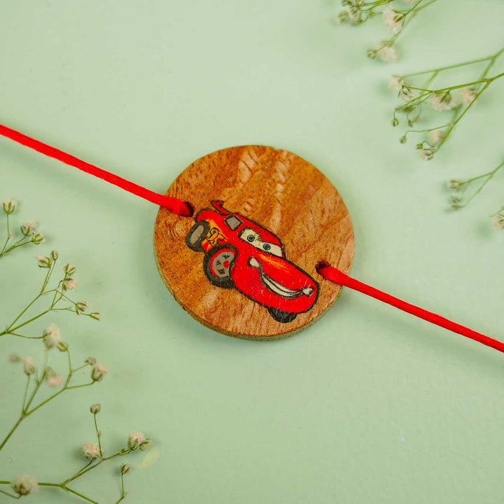 Personalized Hand Painted Cars Theme Wooden Rakhi With Roli Chawal - Close-up with Decorative Accent