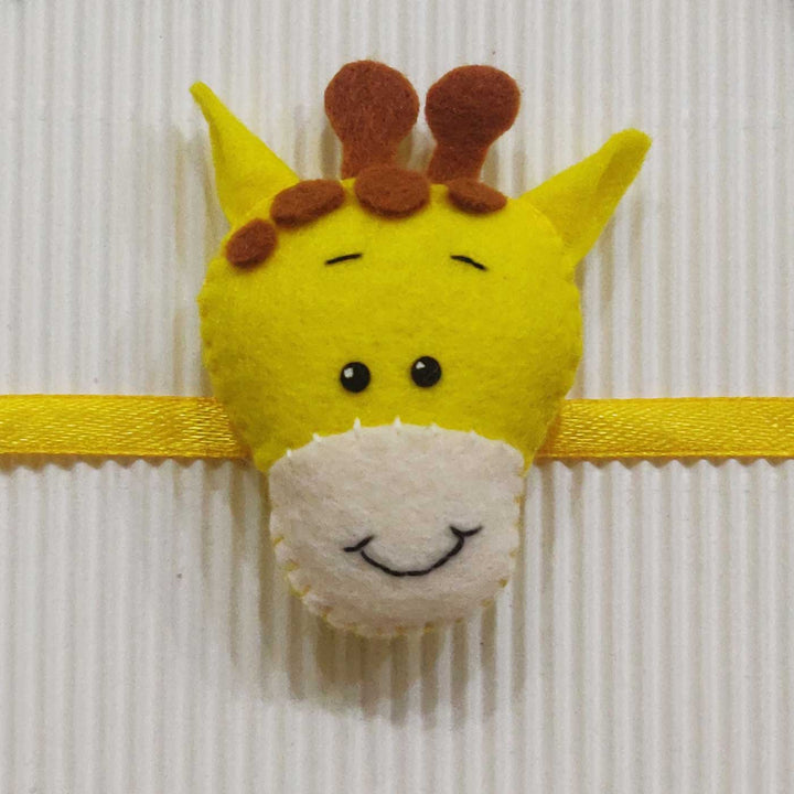 Handmade Giraffe Theme Felt Kids Rakhi With Roli Chawal 10 - Close-up on Giraffe Decoration