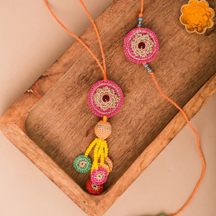 Handmade Crochet Pink Mandala Bhaiya Bhabhi Rakhi With Roli Chawal Set Of 2 - Close-up of Hanging Decorative Piece