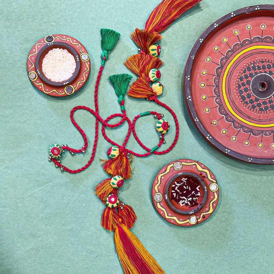 Handmade Reusable Red Potli And Jhumki Rakhi For Bhaiya And Bhabhi - Full Accessory Layout