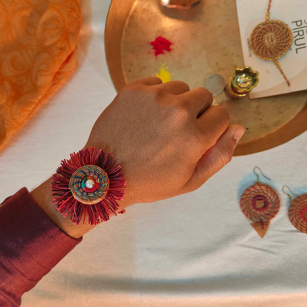 Eco Friendly Handmade Red And Pink Pine Needle Rakhi With Pouch And Roli Chawal - Worn on Wrist