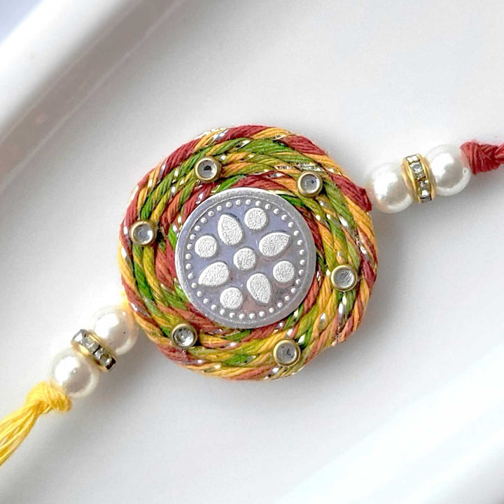 Handmade Lotus Design Silver Rakhi Hamper With Roli Chawal For Brother - Close-up of Rakhi Detail