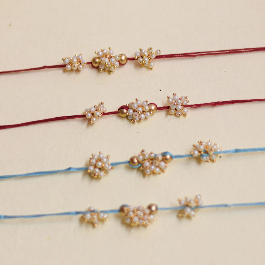 Handmade Triple Bajra Ghungroo And Pearl Rakhi With Roli Chawal - Four Bracelets Front View