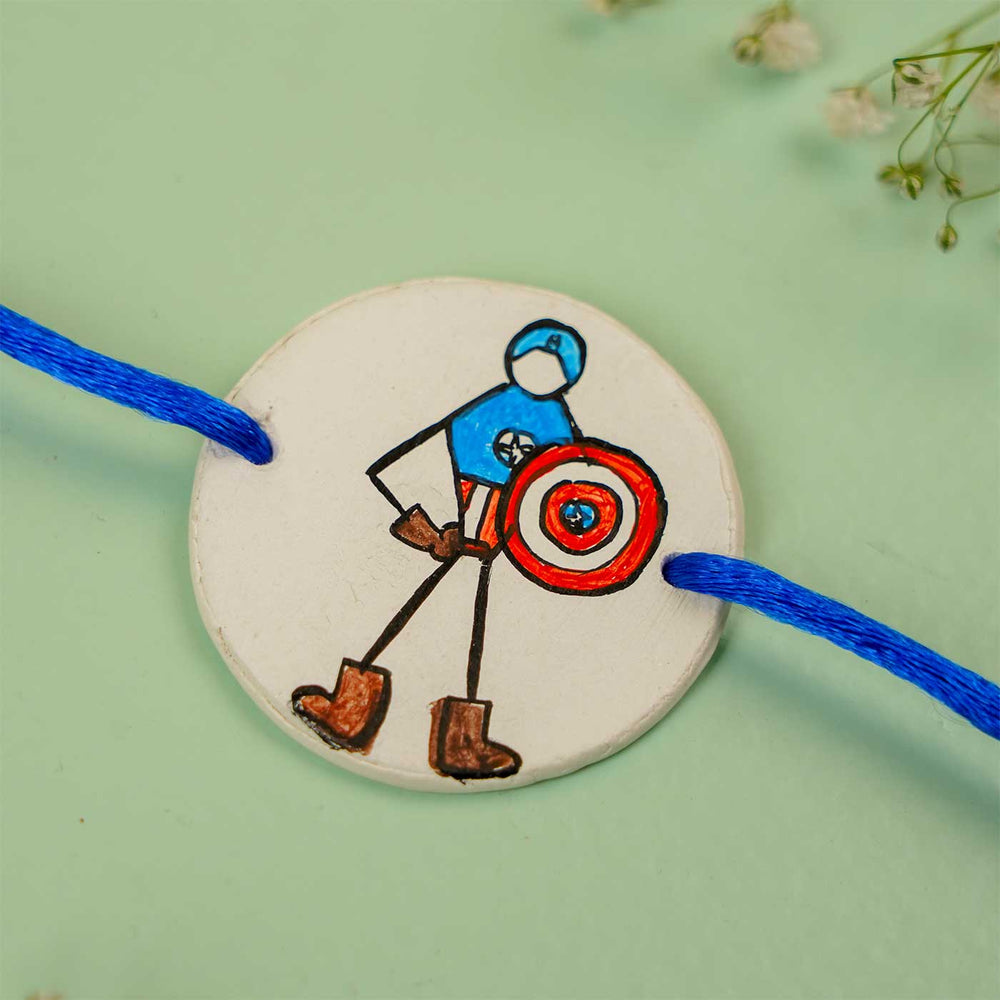 Personalized Hand Painted Captain America Clay Rakhi With Roli Chawal - Close-up of Bracelet Design