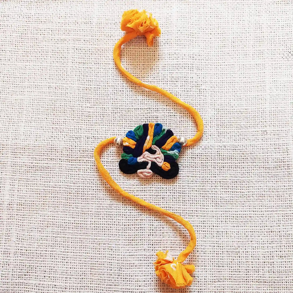 Handmade Dori Work And Ghungroo Raja Rani Bhaiya Bhabhi Rakhi With Roli Chawal Set Of 2 - Front View of Headpiece Only