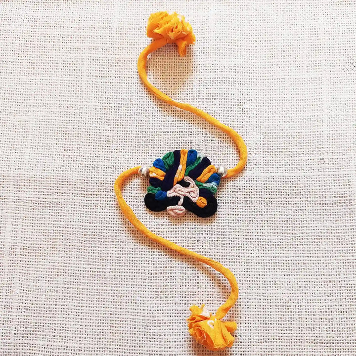 Handmade Dori Work And Ghungroo Raja Rani Bhaiya Bhabhi Rakhi With Roli Chawal Set Of 2 - Front View of Headpiece Only