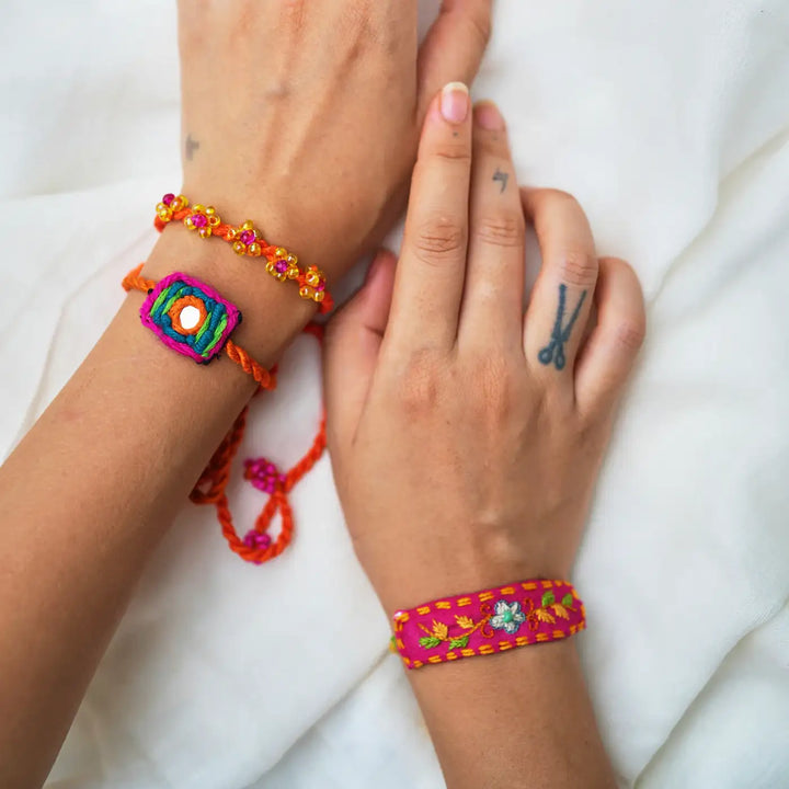 Handmade Embroidered And Beaded Patola Rakhi With Roli Chawal Set Of 3 - Wristwear Style Display