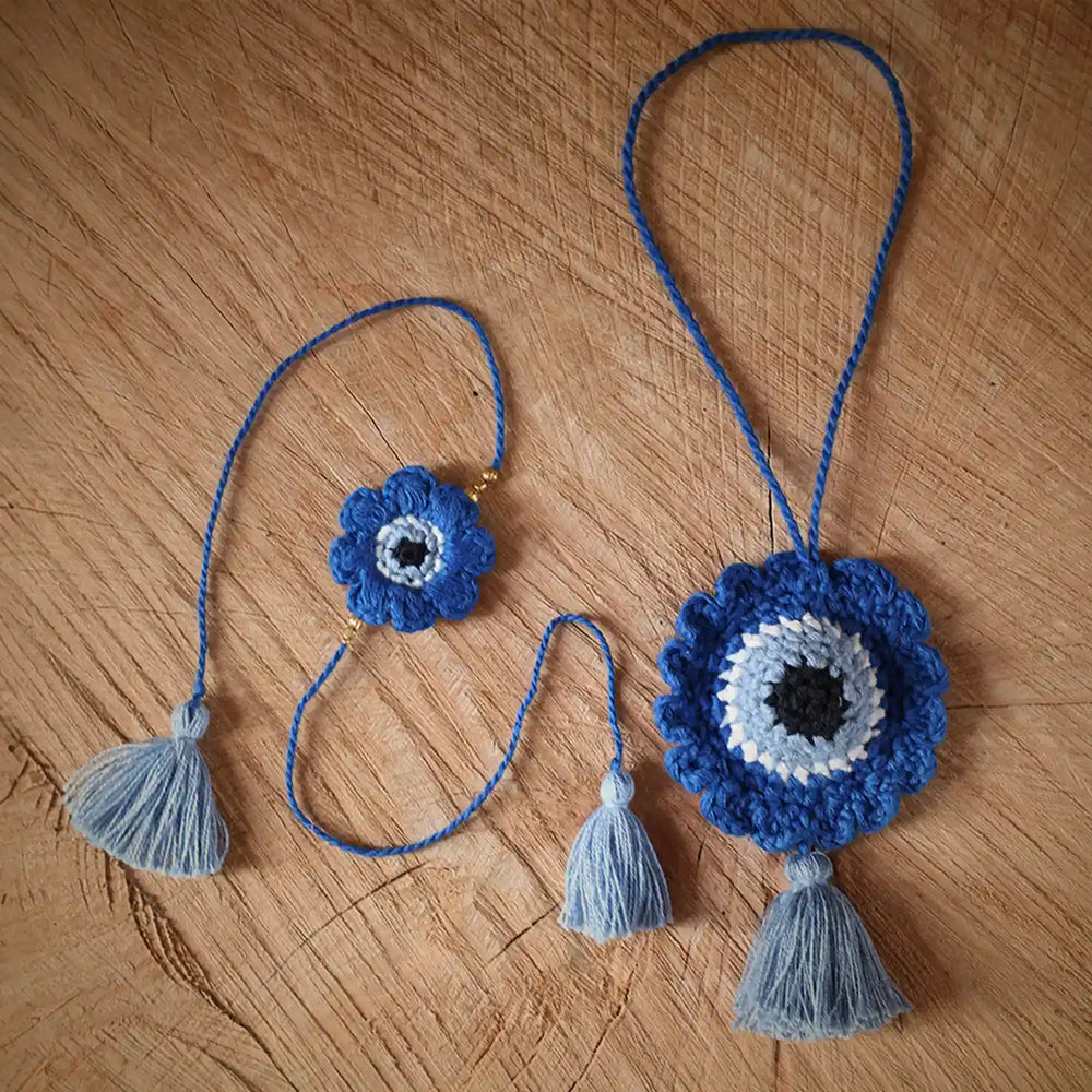 Handmade Crochet Evil Eye Rakhi And Bunting Combo With Roli Chawal Set Of 2 - Top view of necklace