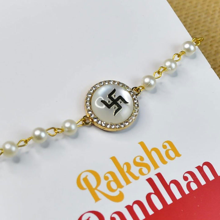 Beaded Swastik Bracelet Rakhi Hamper With Chocolates And Roli Chawal For Brother Customizable Options Includes Up To 7 Goodies - Detailed view on Raksha card