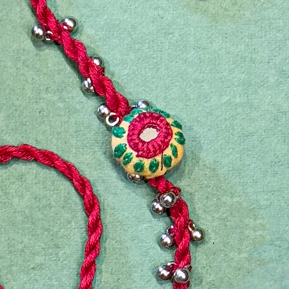 Handmade Reusable Red Potli And Jhumki Rakhi For Bhaiya And Bhabhi - Close-up Detail of Pendant