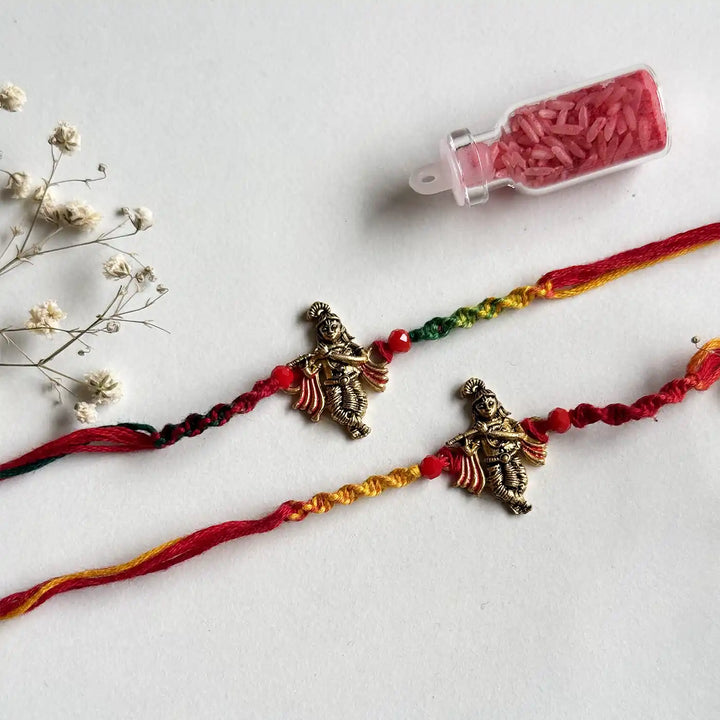Handmade Krishna Motif Rakhi With Roli Chawal - Angled view with decorative elements