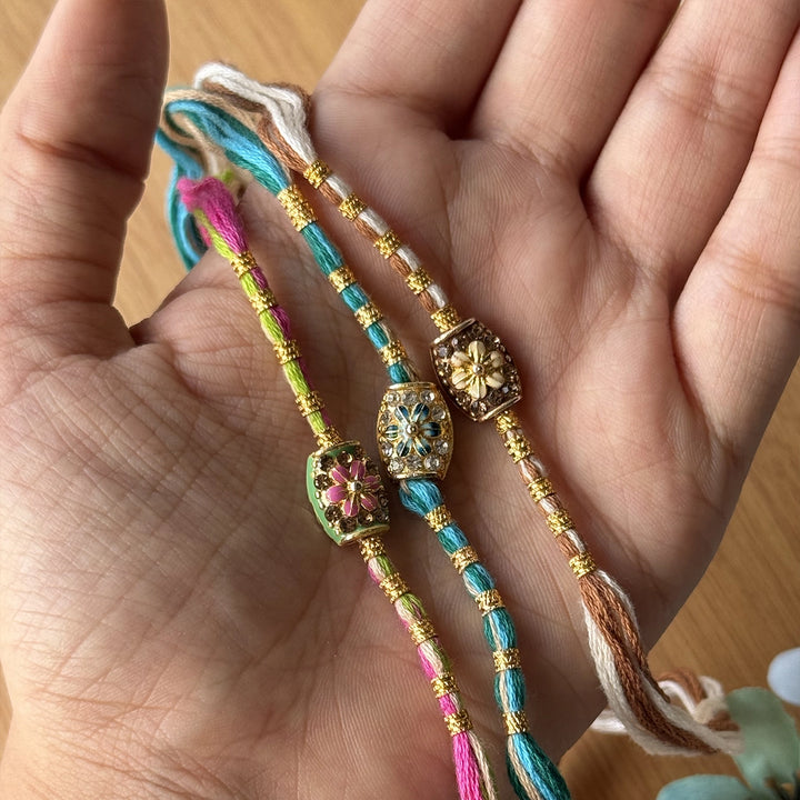 Handmade Stone Embedded Flower Rakhi With Roli Chawal - Hand-Held Display