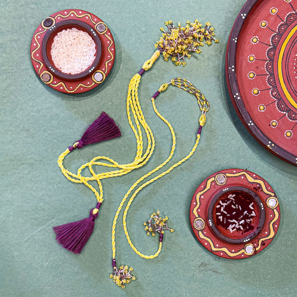 Handmade Reusable Yellow Corel And Jhumki Rakhi For Bhaiya And Bhabhi - Full Product Layout with Decor