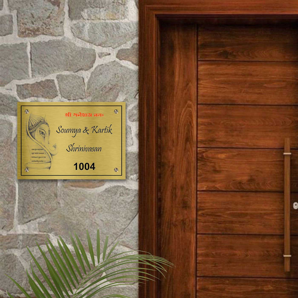 Personalized Weatherproof Ganesha Theme Gold Stainless Steel Name Plate - Mounted on Stone Wall Near Door