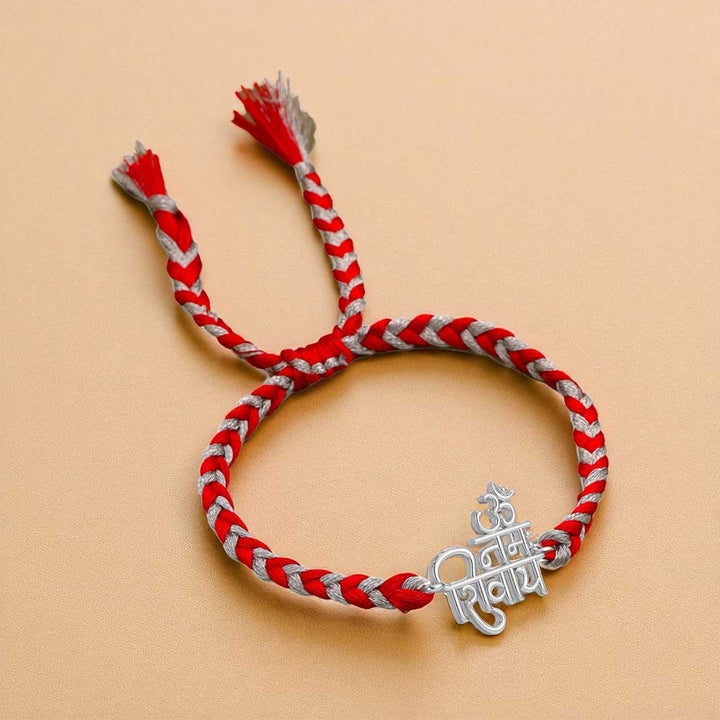 Handmade Nama Shivaya Design Religious Silver Rakhi For Brother - Front View on Different Background