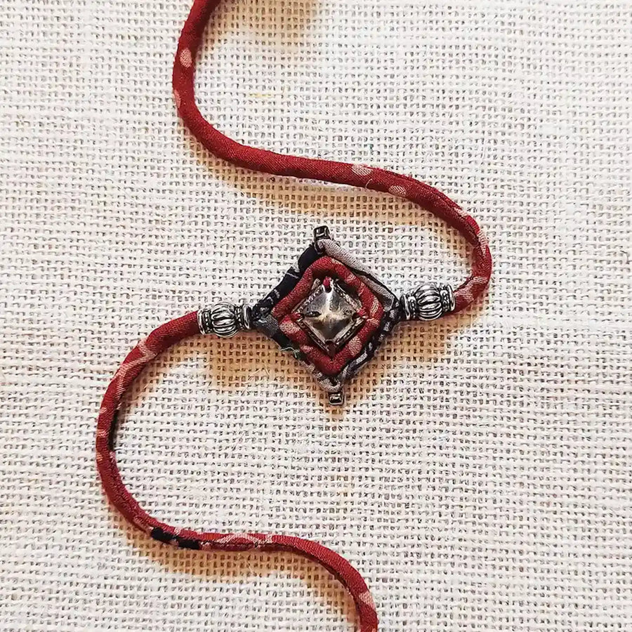 Handmade Dori Work Antique Metal Rakhi With Roli Chawal - Close-up of central design