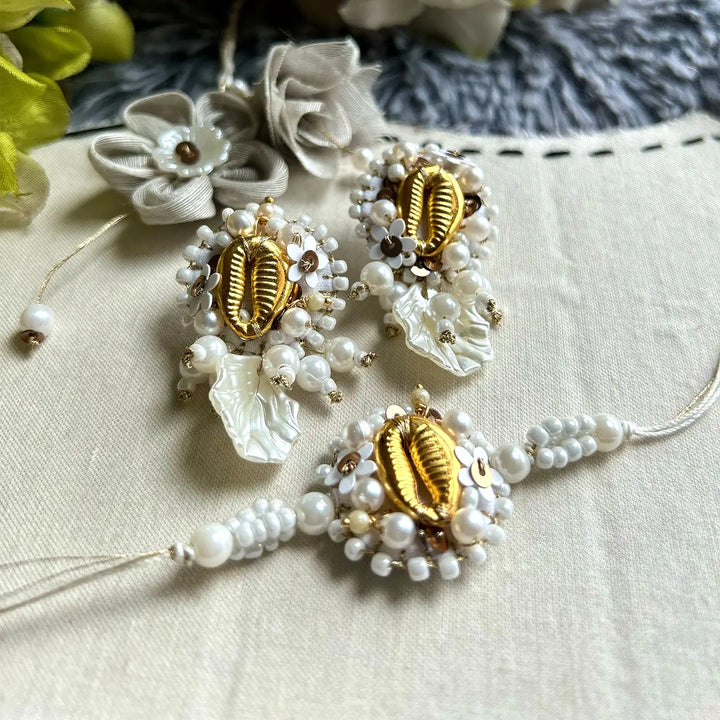 Hand Embroidered Beaded Golden Shell Bhaiya Bhabhi Rakhi With Roli Chawal Set Of 2 - Decorative Arrangement View