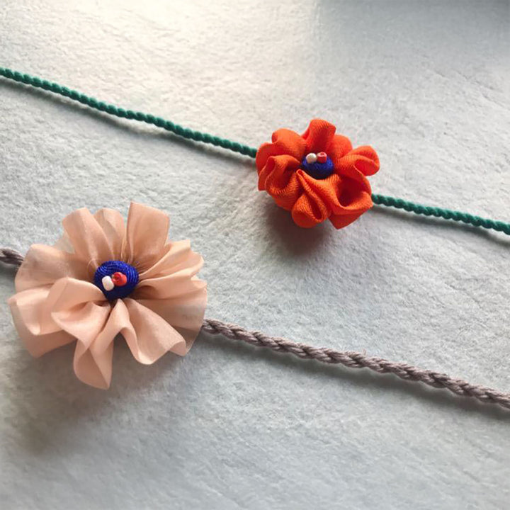 Handmade Flower Design Pom Pom Upcycled Fabric Rakhi With Roli Chawal For Brother - Full Length Detail View