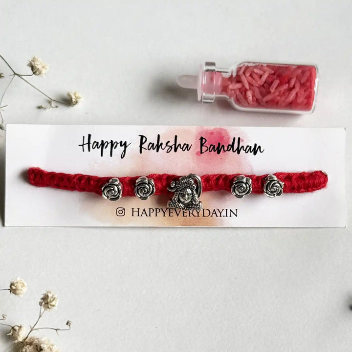 Handmade Shiv Motif Rakhi With Roli Chawal - Close-up on Packaging Display