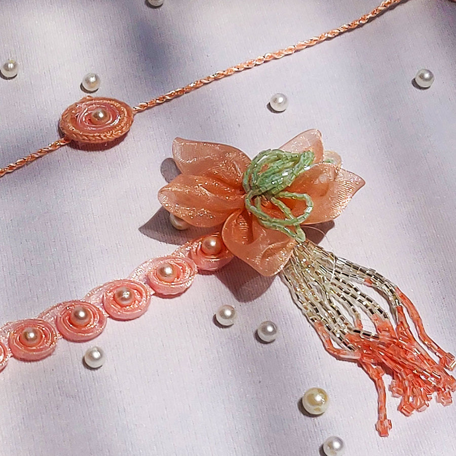 Handmade Pastel Floral Bliss Pearl Bhaiya Bhabhi Rakhi With Roli Chawal - Close-up of full bracelet