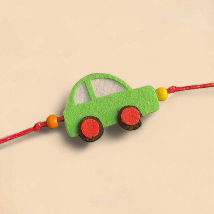 Customized Handmade Beaded Car Theme Pom Pom Felt Rakhi With Roli Chawal For Kids - Green Car Bracelet Close-up